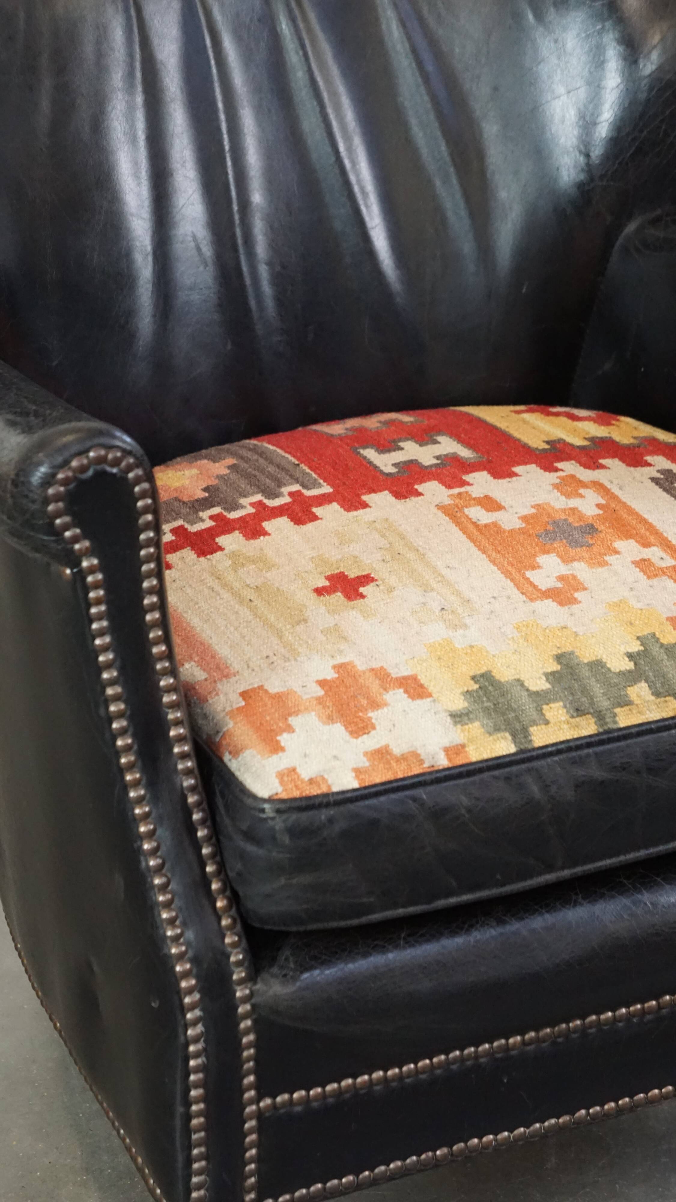Fauteuil en cuir de vachette noir