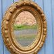 Miroir ancien en bois doré