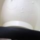 White Tissot wall light with opaque glass globe, 1970s/80s