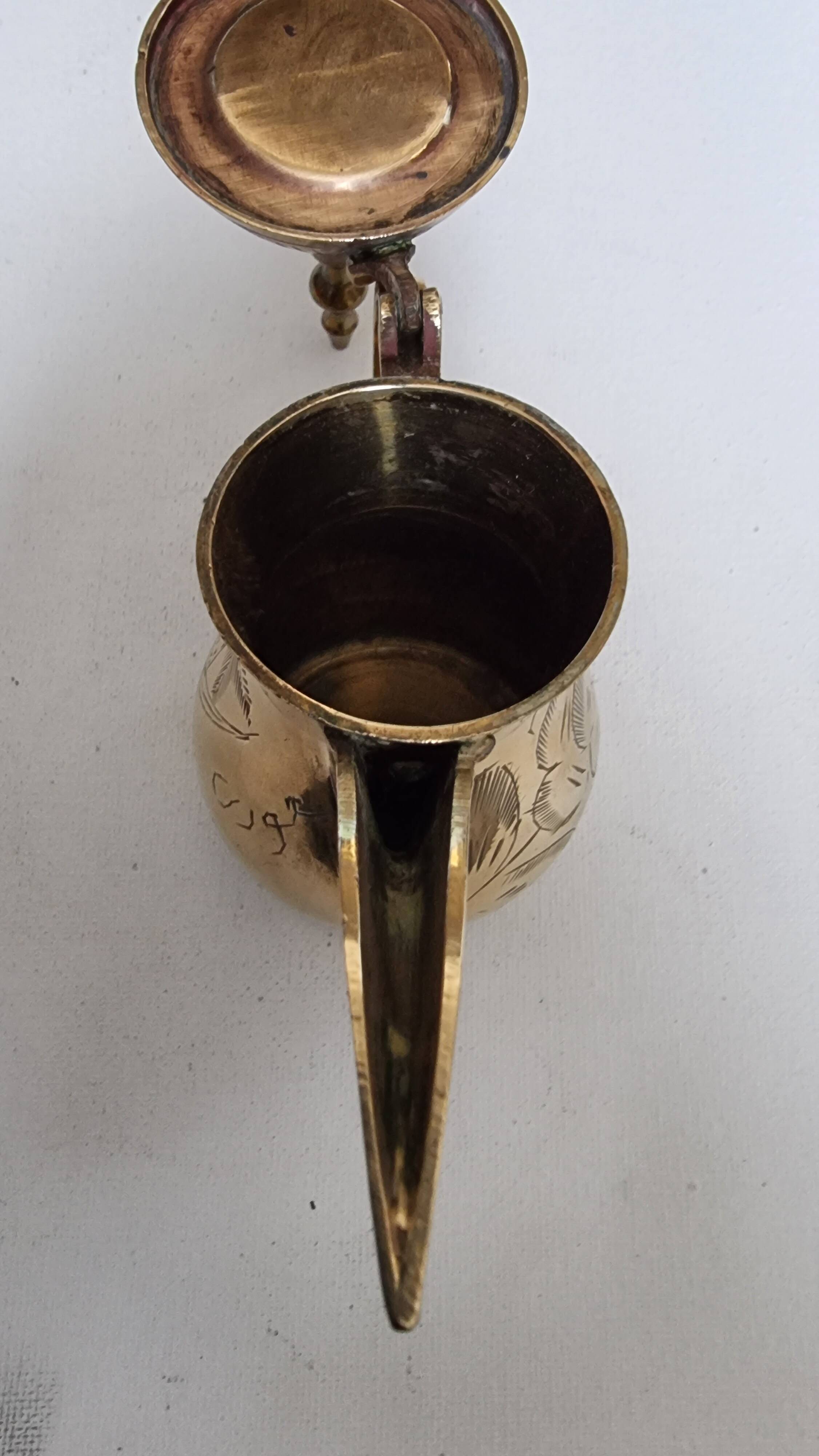 Small carved brass pourer
