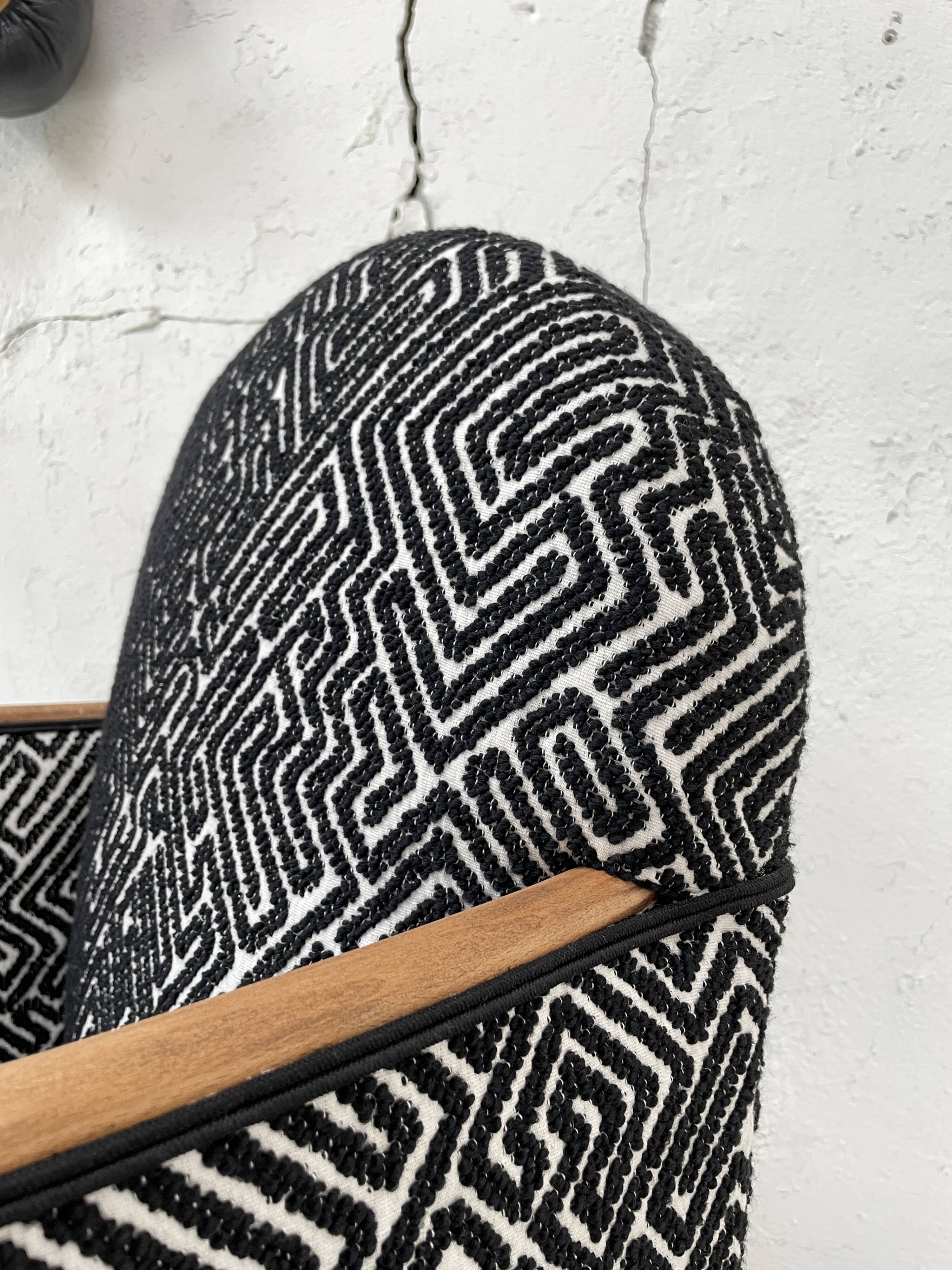 Club armchair in wood and fabric.