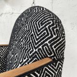 Club armchair in wood and fabric.