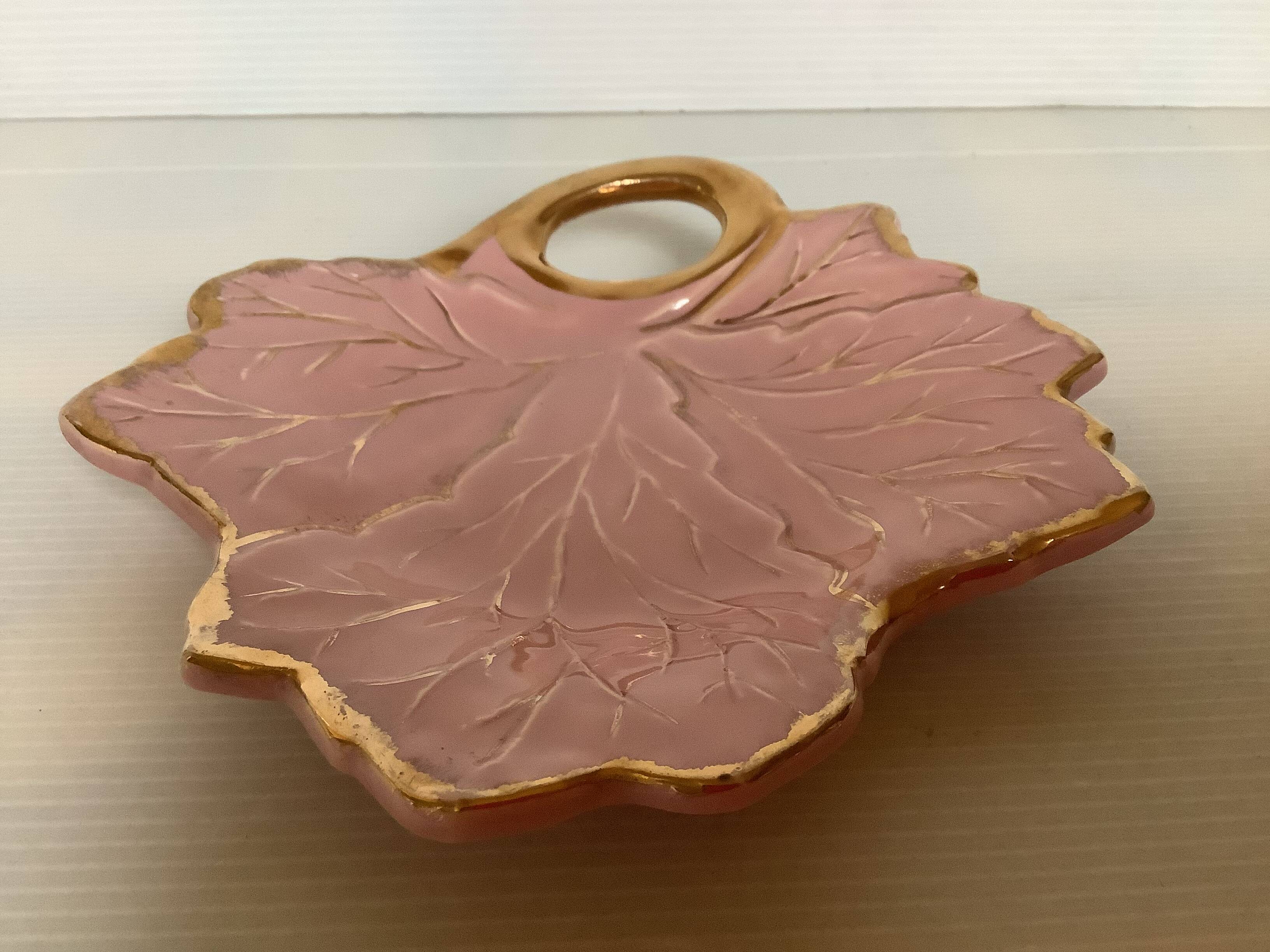 Tray, ring holder in the shape of a pink and gold leaf.