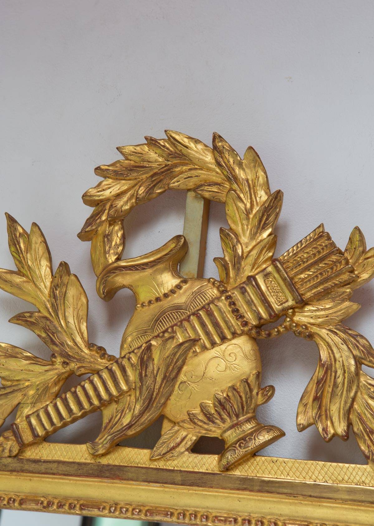 French gold mirror with a Louis XVI style pediment c. 1940/50 (95*54 cm)