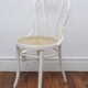 White wooden chair with cannage