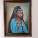 Portrait of a young Moroccan woman in traditional attire and adornments.