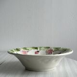 Ceramic slip dish with strawberry and flower pattern.
