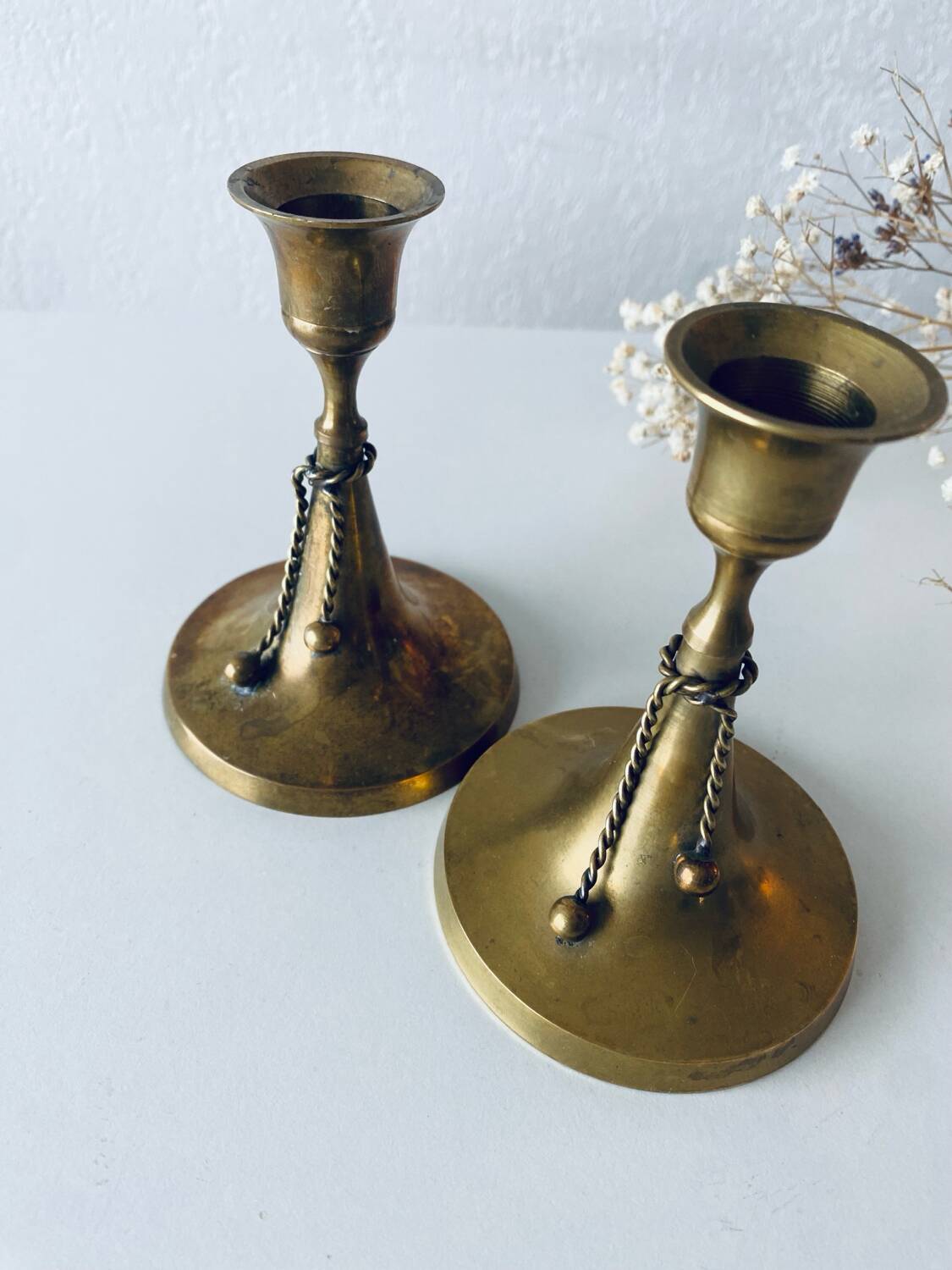 Pair of brass cord candle holders
