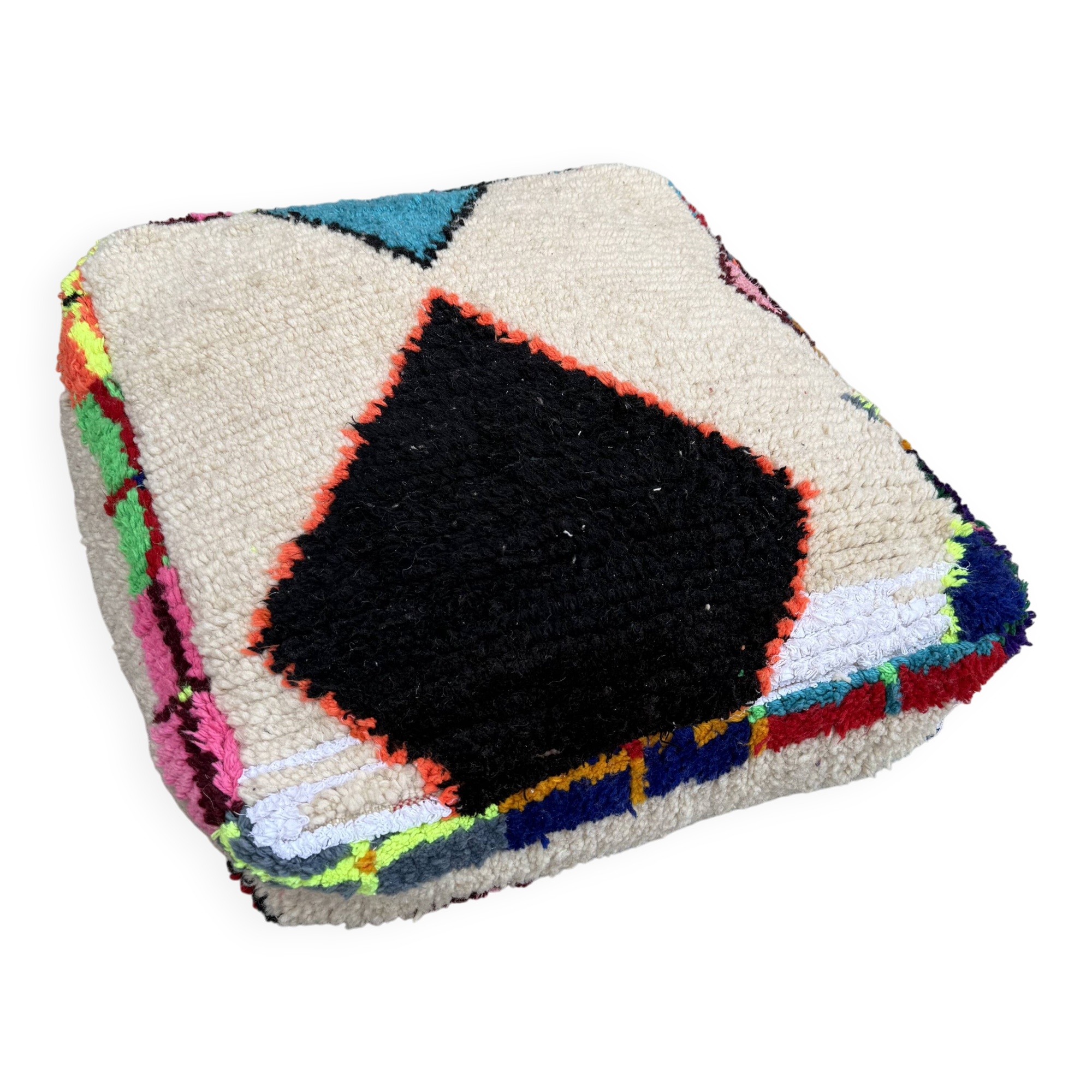 Berber floor pouf: Handwoven Moroccan wool cushion.
