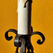Old metal lamp and fake candle