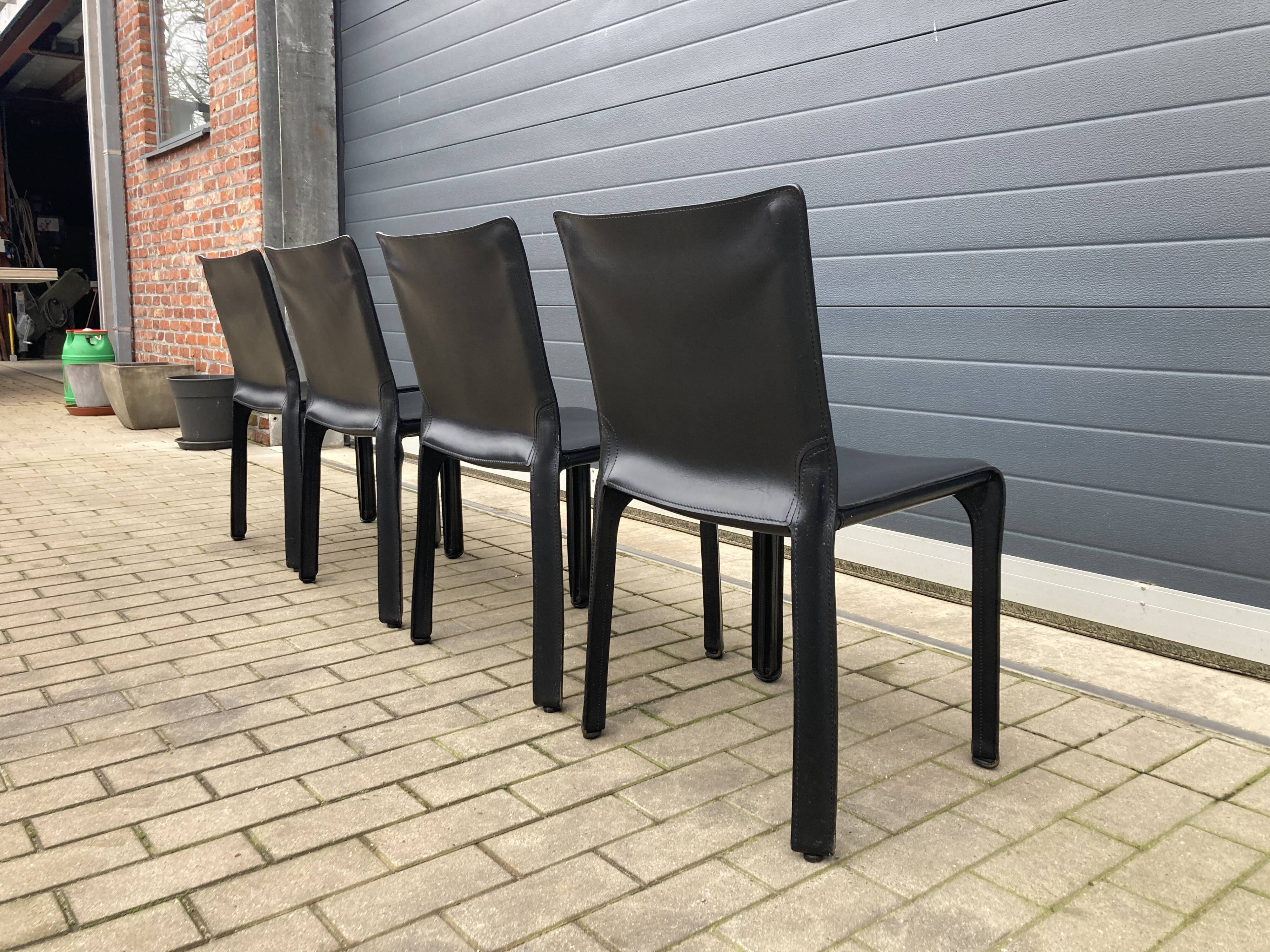 4 black Cassina Cab chairs by Mario Bellini