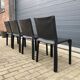4 black Cassina Cab chairs by Mario Bellini