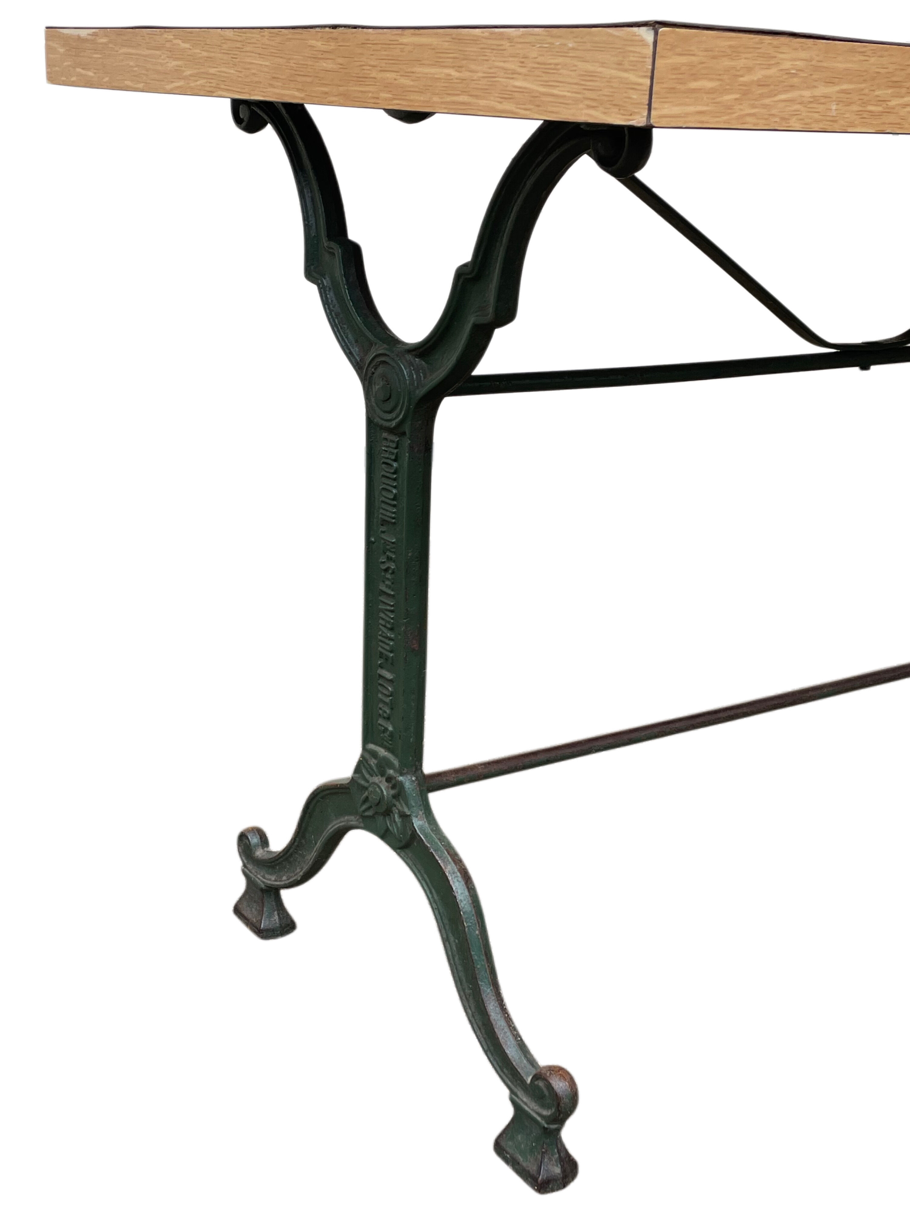 Old bistro table in engraved wrought iron