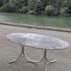 Vintage oval design table in smoked glass and chrome legs