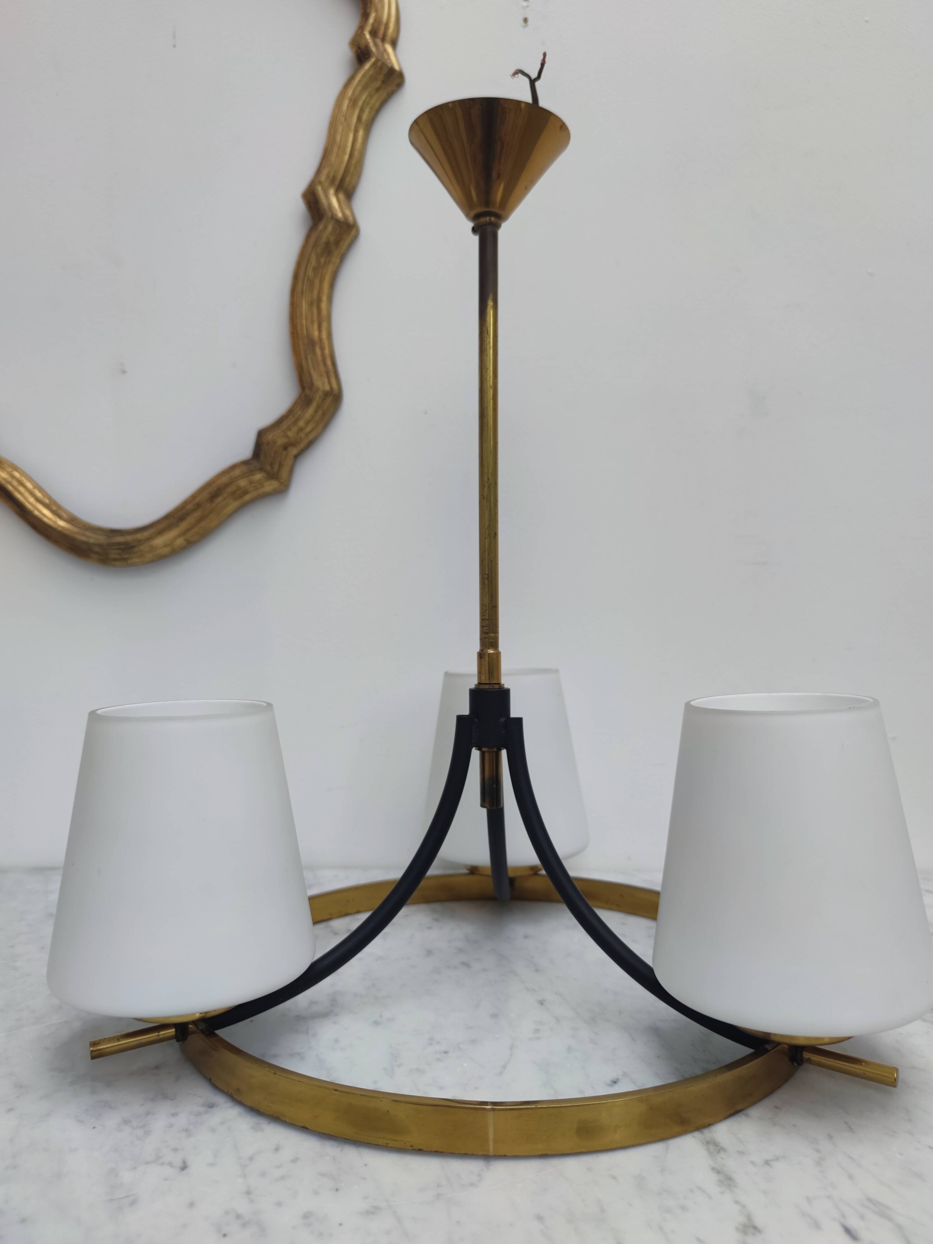 Brass chandelier and white opalines