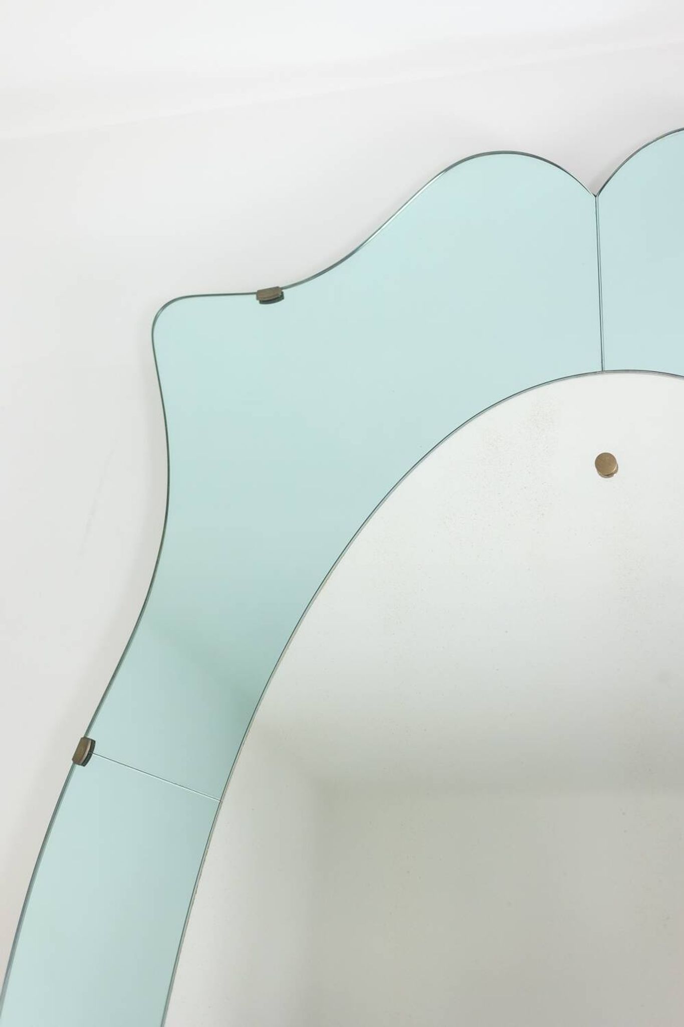 Two-tone glass console mirror with gilded brass. Circa 1950.