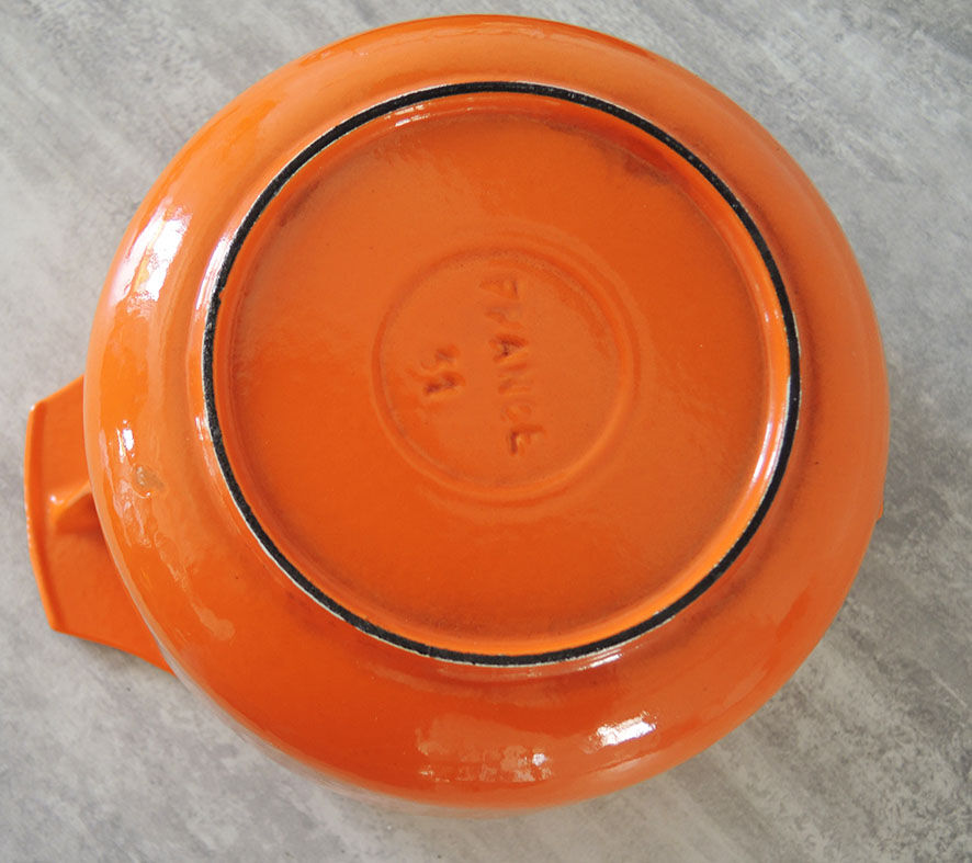 Nomar fondue service in orange cast iron
