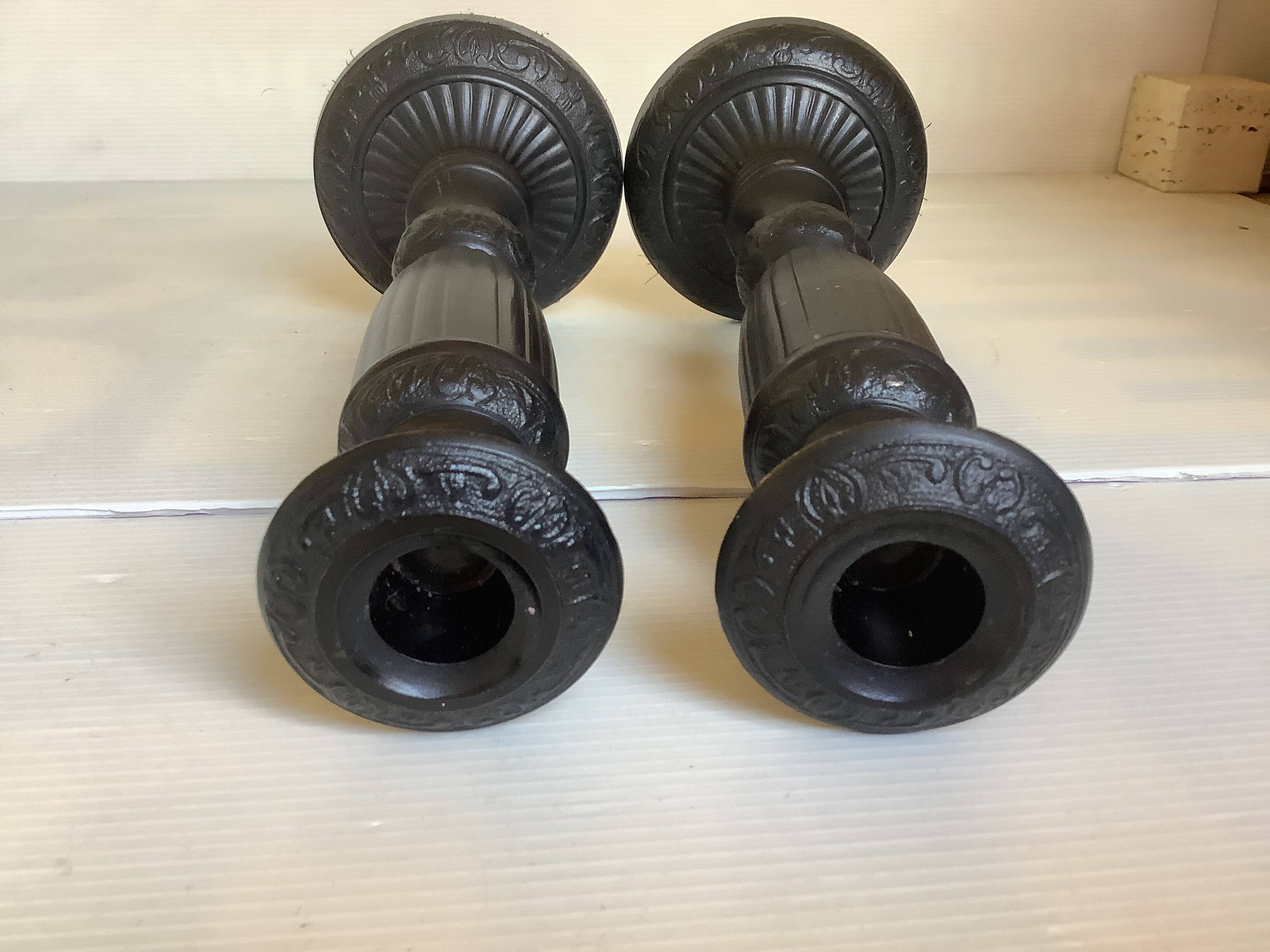 Pair of large black metal candlesticks