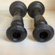 Pair of large black metal candlesticks