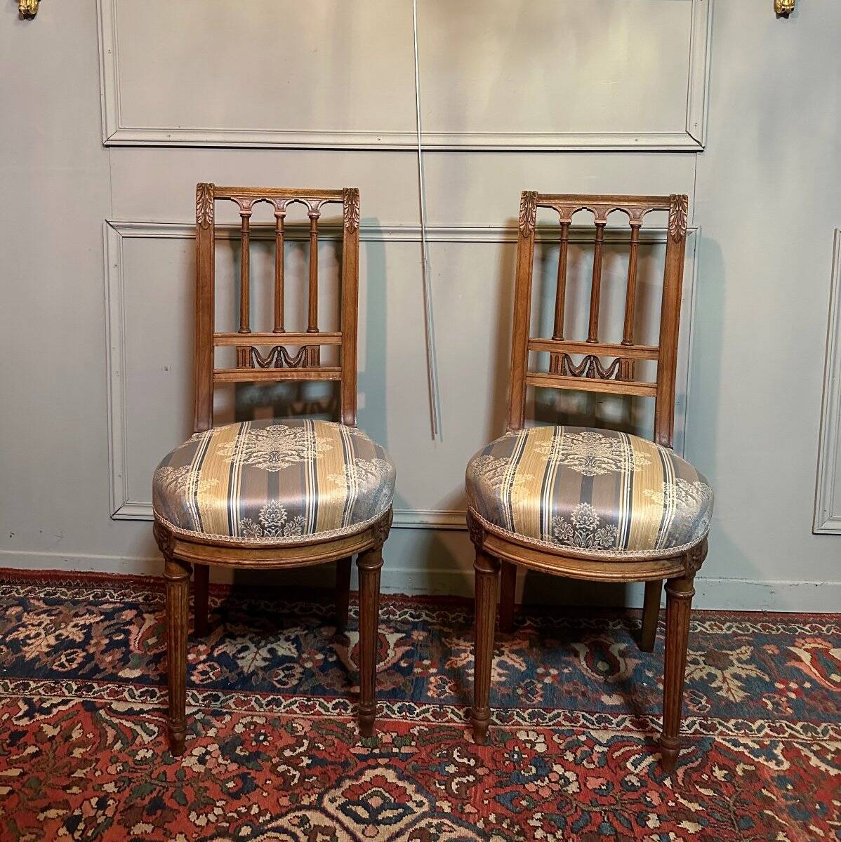 Pair Of Louis XVI Style Chairs In Walnut.