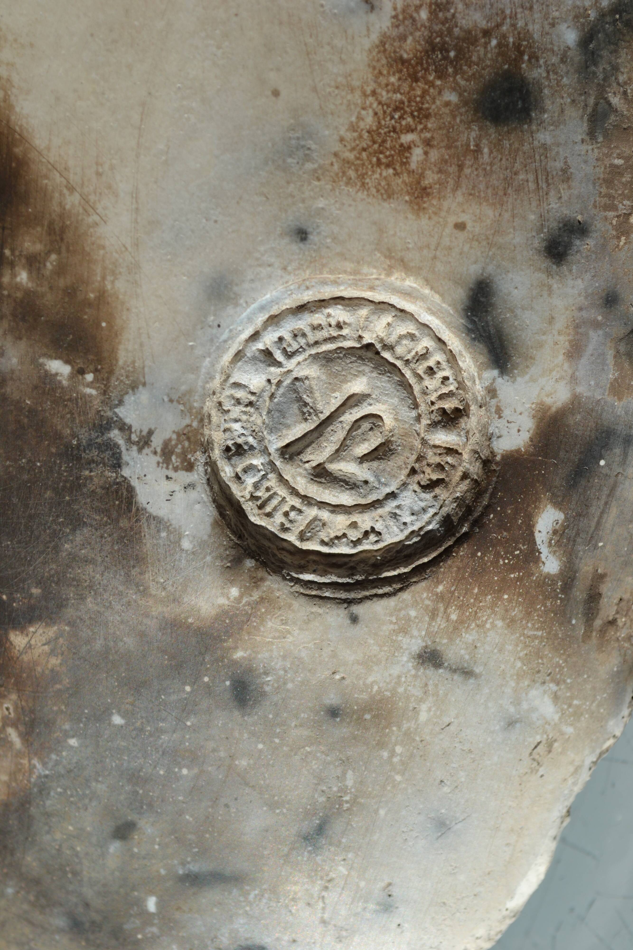 Male torso sculpture by patinated casting, signed to be identified.