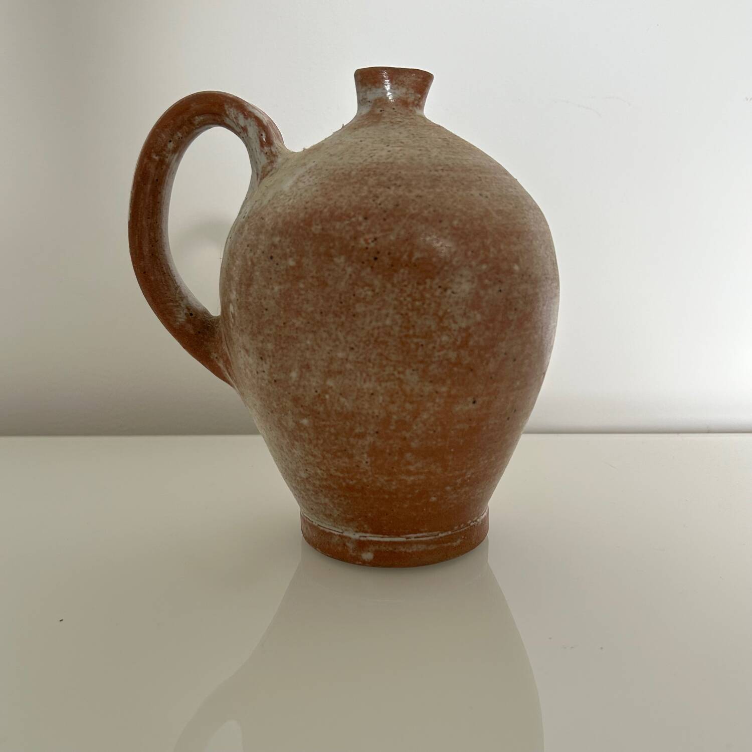 Patinated stoneware jug
