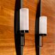 PAIR OF SCANDINAVIAN DESIGN METAL AND GLASS CANDLE HOLDERS.