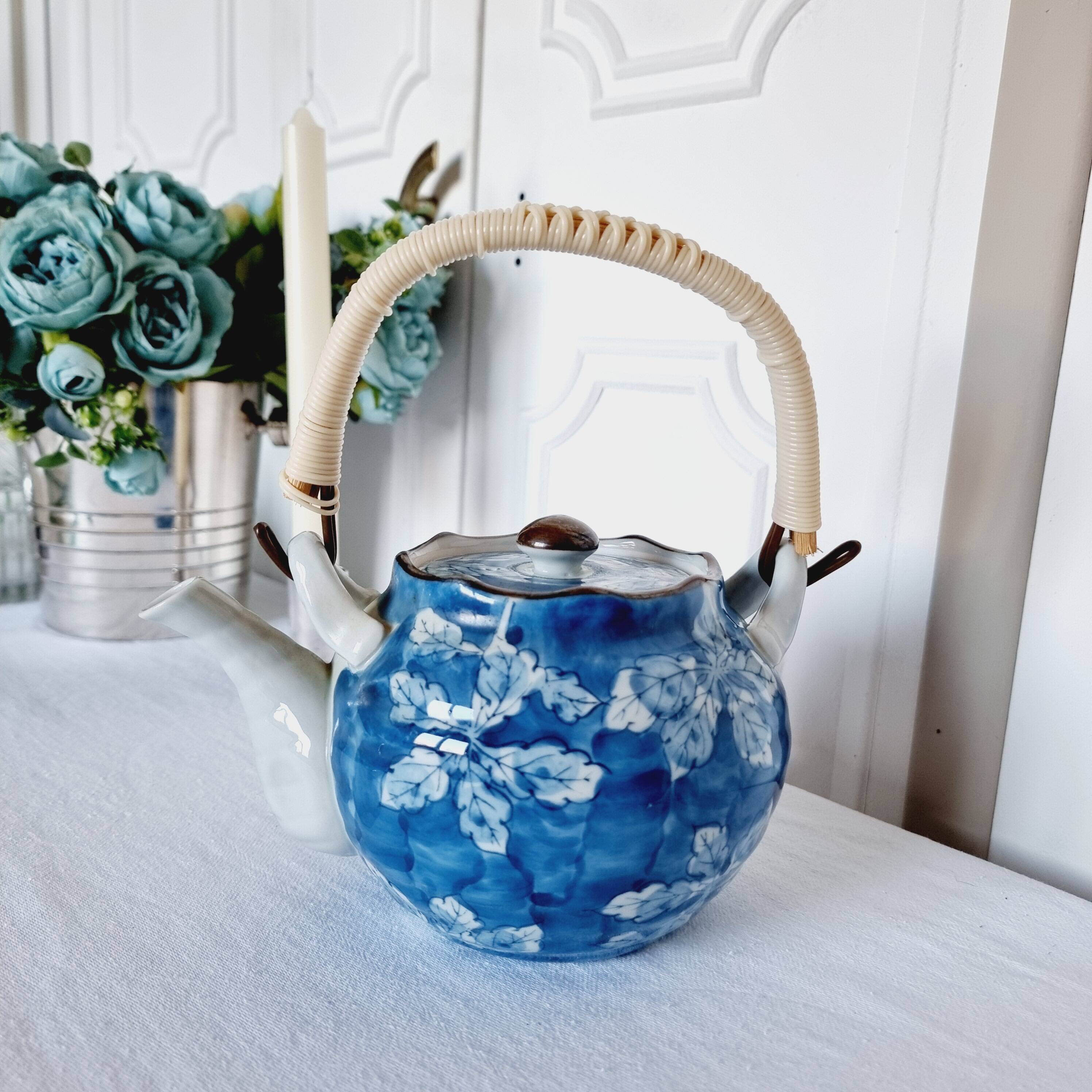 Handcrafted Japanese porcelain teapot hand painted in blue and white.
