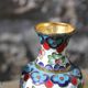 Two small vintage cloisonné enamel vases with Asian floral decoration.