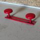 Set of 4 red metal coat hooks