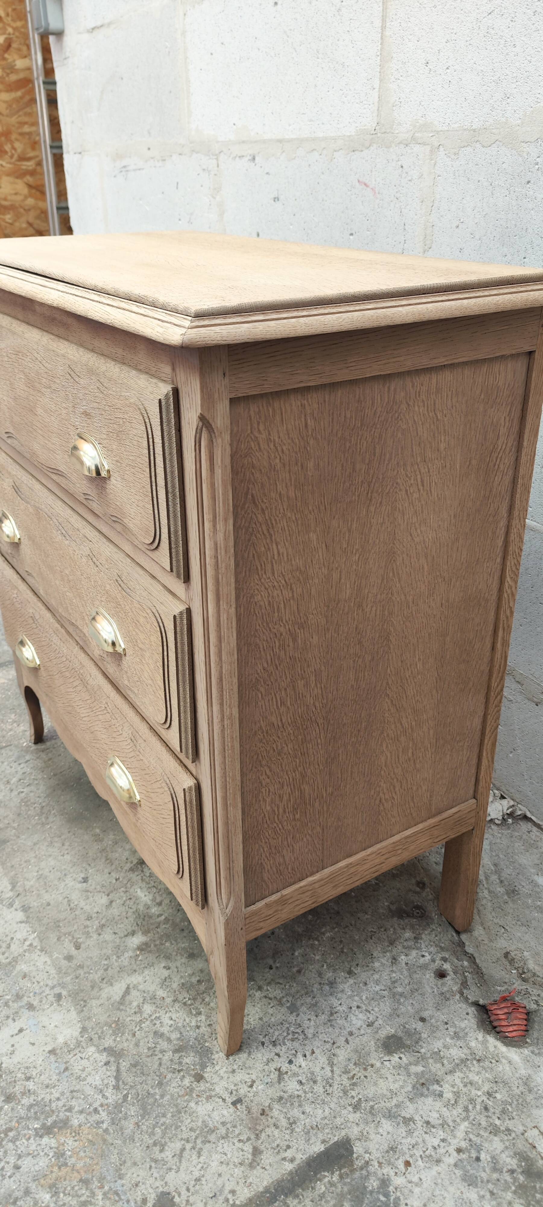 Old three-drawer chest of drawers in raw oak