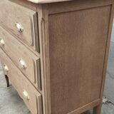 Old three-drawer chest of drawers in raw oak