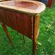 half-moon bedside pair in marquetry, bronze ornaments