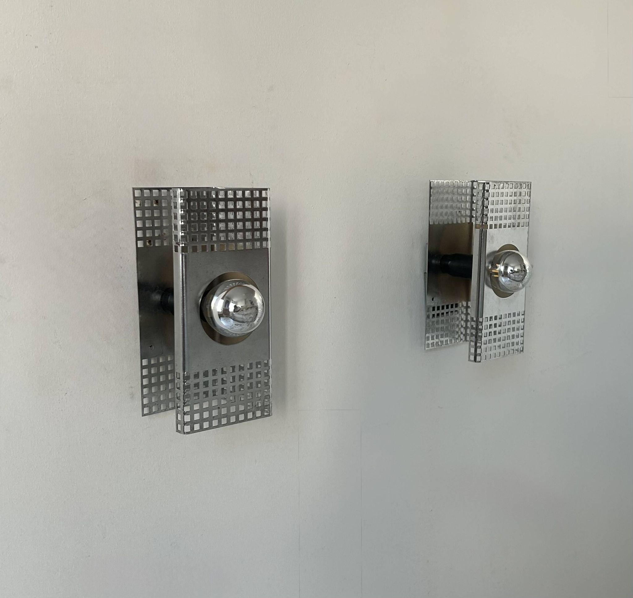 Pair of vintage wall lights, chrome-plated metal, France 1970.