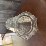 Transparent glass vase with relief floral decoration from the 1980s, fluted neck and polygonal base.