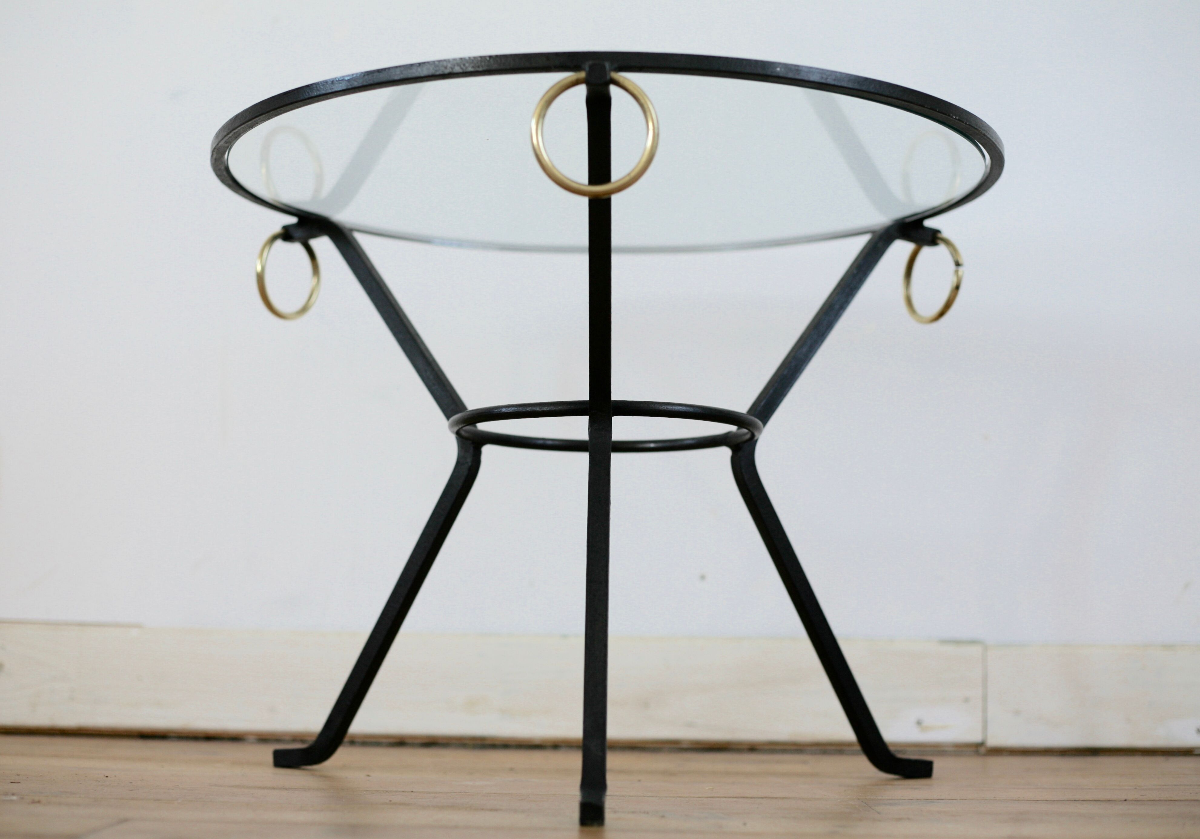 Coffee table black lacquered metal, glass and brass, France, circa 1950.