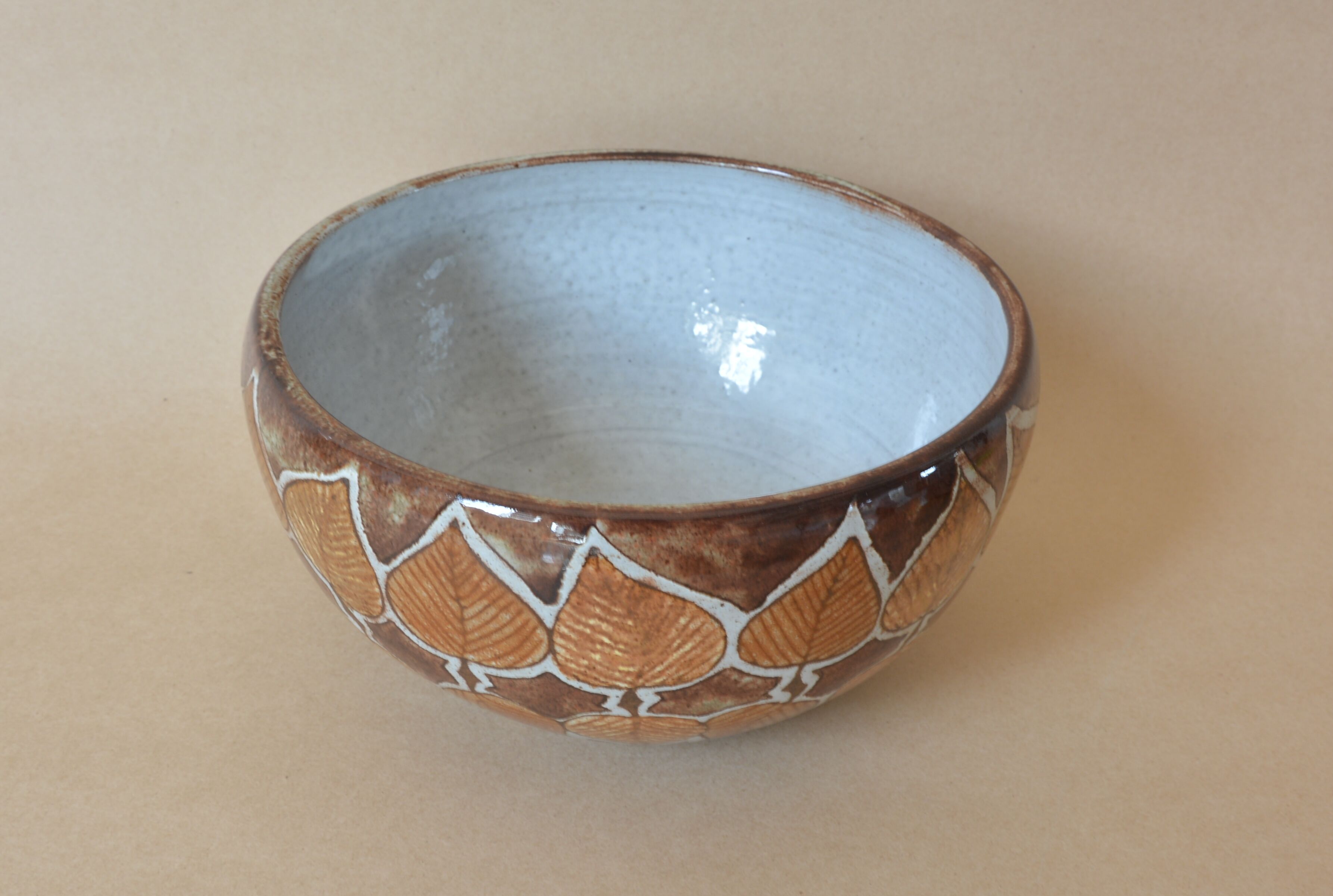 Cup with stylized leaf decoration by Jean-Claude Malarmey