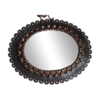 1960s oval mirror in carved leather