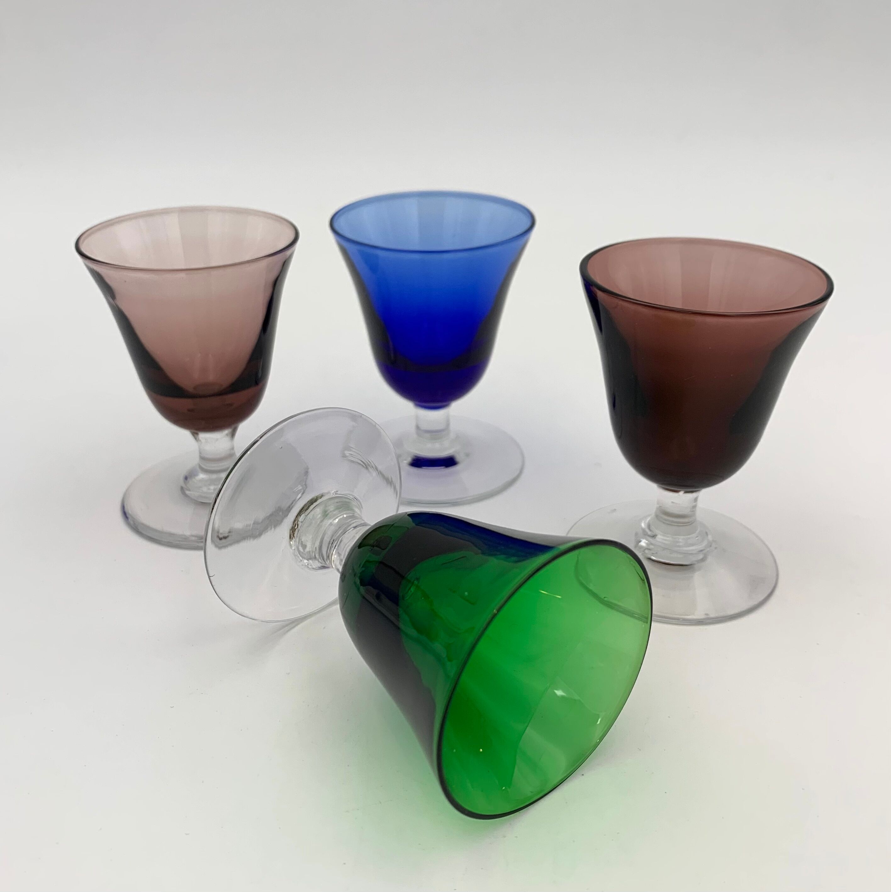 Nine vintage liquor glasses, coloured glass 20th century