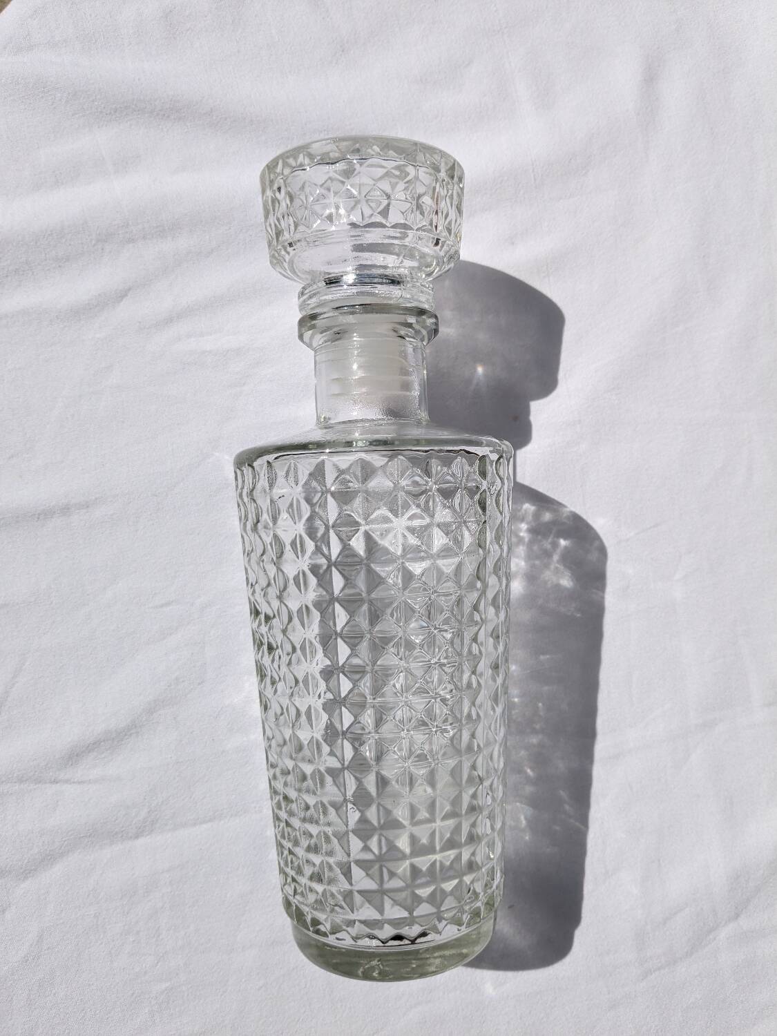 Old relief glass carafe with stopper