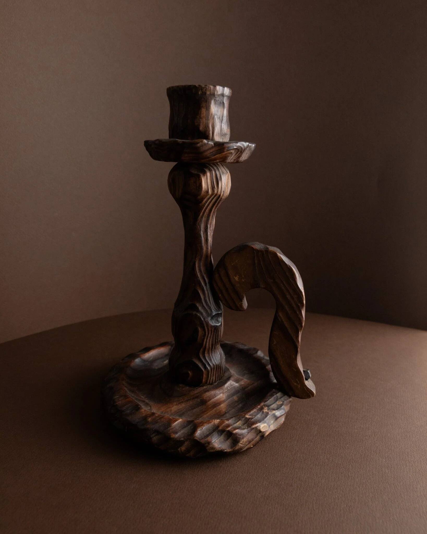 Brutalist carved wood candle holder, dark brown with lighter highlights, made in Italy, 1940s