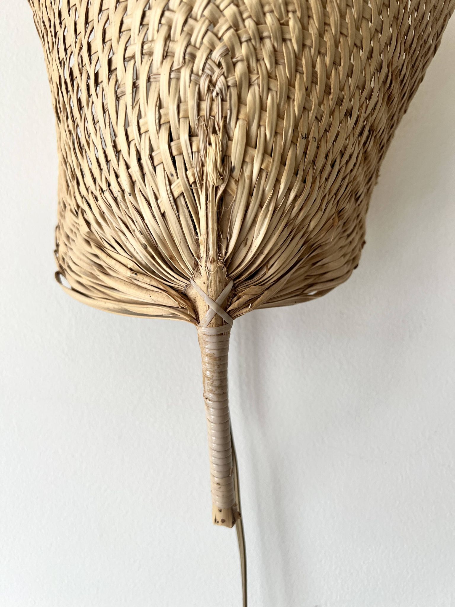 Woven rattan wall light in the style of Igno Maurer, design from the 1970s.