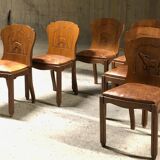 Set of 6 vintage solid wood chairs with animal motif on the back and leather seat