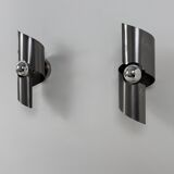 Pair of vintage wall lights, curved patinated steel, France, 1970.