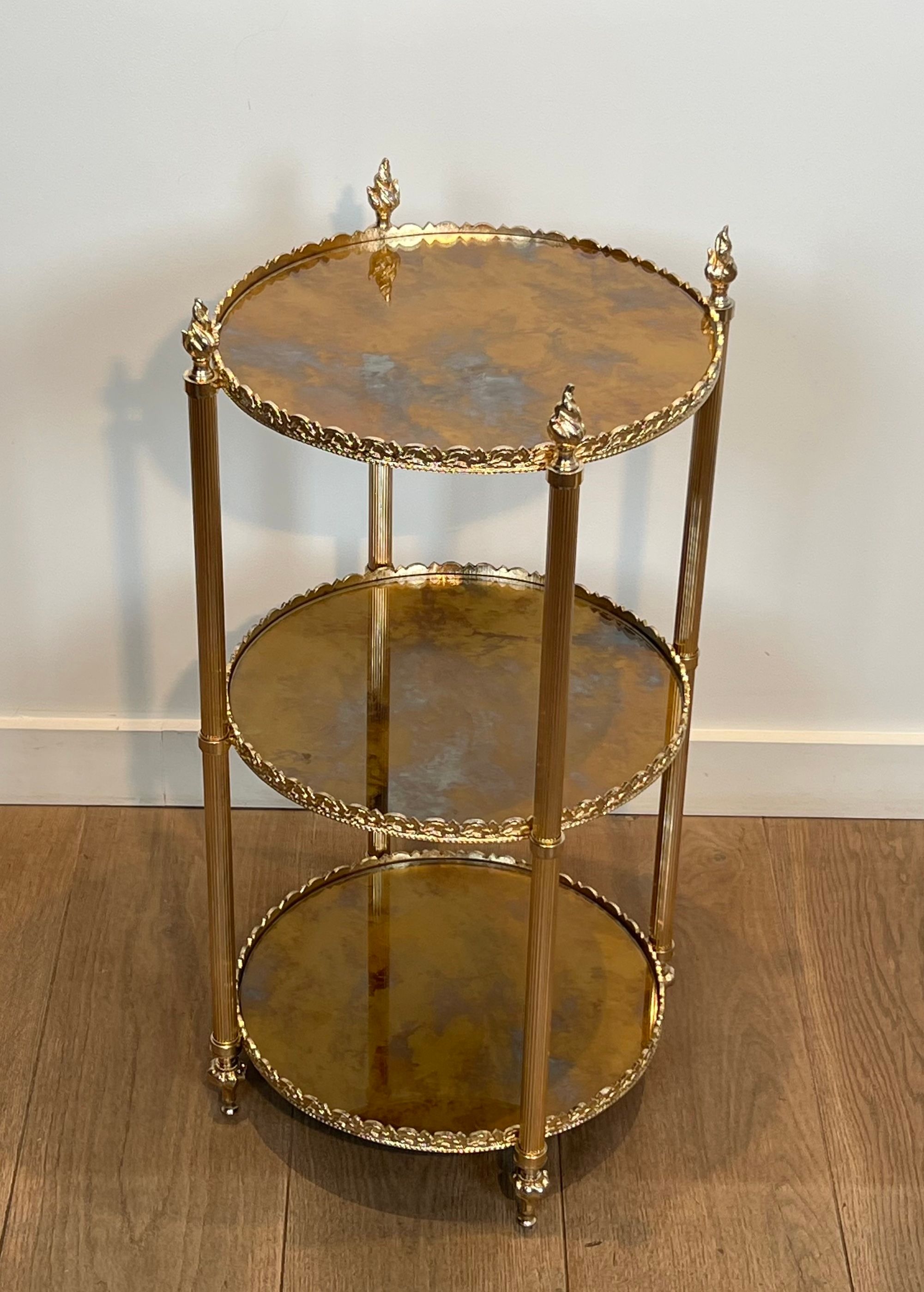Round silver-plated brass table with triple eglomisé mirror tops from Maison Jansen.