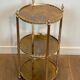 Round silver-plated brass table with triple eglomisé mirror tops from Maison Jansen.