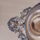 Chiseled silver-plated metal cup.