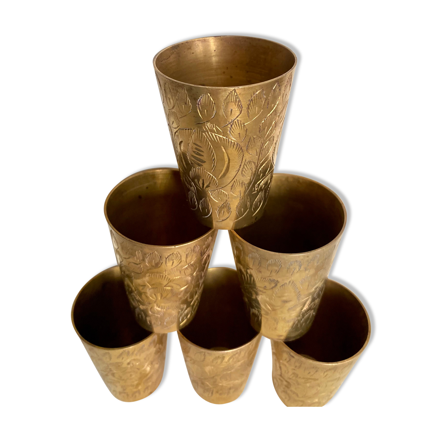 Six chiseled metal glasses