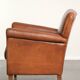 Sturdy vintage sheepskin armchair with a beautiful cognac colour