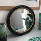 black and gold oval mirror